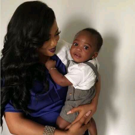 PHOTO: Toke Makinwa carrying Tiwa Savage’s Son
